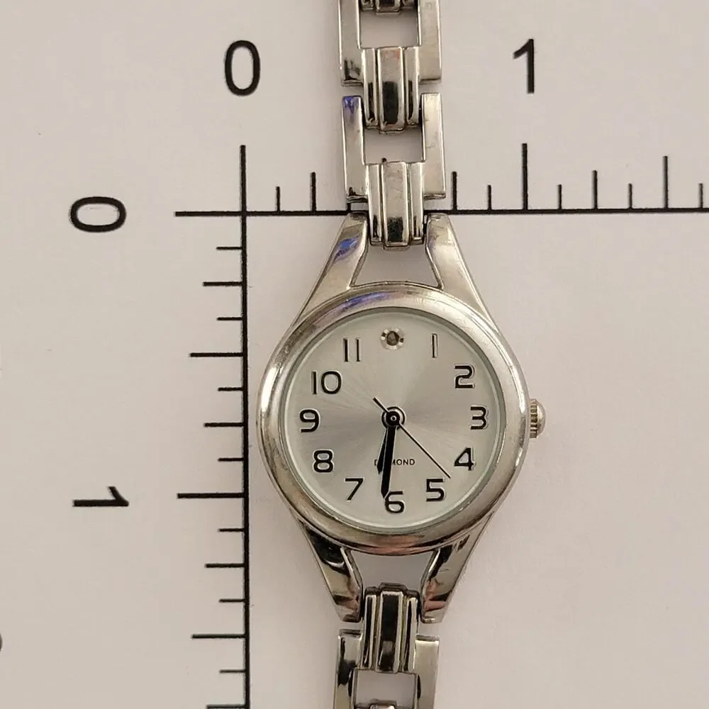 Womens Watch Silver Dial Silver Case Bracelet Clasp Quartz Diamond Accent